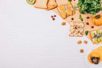 Flat lay frame of sweet fruit toast ingredients with copy space