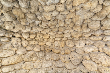 Old antique round stones as background or backdrop