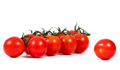 Cherry tomatoes isolated over white background