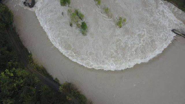 Drone aerial view of the Serio river swollen after heavy rains. Province of Bergamo, northern Italy