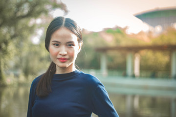 Portrait charming beautiful Asia woman at garden park nuture background.