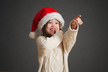 little beautiful girl with red santa hat