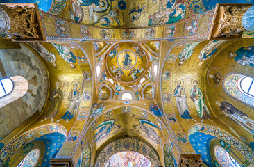 Fototapeta na wymiar The golden dome with Christ in throne in The Martorana (Cathedral of Saint Mary of the Admiral) in Palermo. Sicily, Italy.