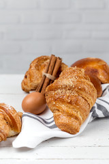 freshly baked buns with almonds. Croissants and brioches