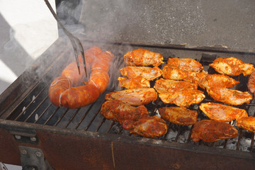 BBQ roast meat, outdoors. Concept of enjoying with friends, family sharing a meal