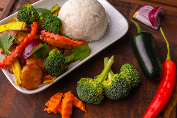 Kung Pao chicken,  also transcribed as Gong Bao or Kung Po.  Is a spicy, stir-fried Chinese dish made with chicken, peanuts, vegetables, and chili. Classic dish in Sichuan Province of south China