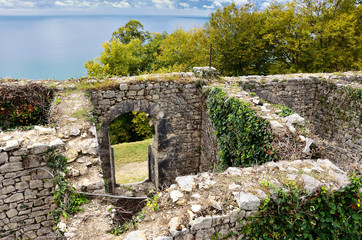 Fototapeta na wymiar The ruins of an old fortress on top of a mountain