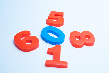 Multicolored numerals arranged chaotically on a white background