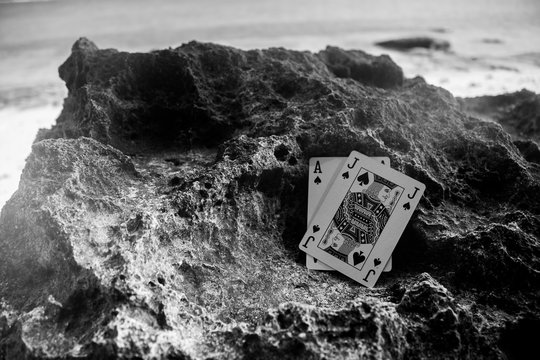 black jack poker card gamble beach theme black and white