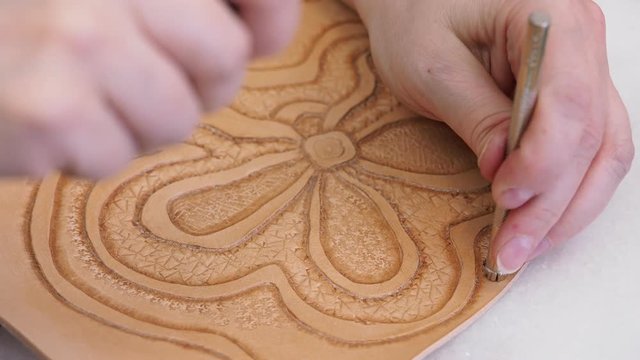 craftsman stamps the relief picture on leather with Background Stamping tool