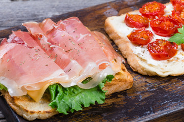 Sliced prosciutto on toasted bread