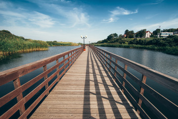 Obraz premium Long wooden promenade. Located on the Sambian Peninsula in Kaliningrad Oblast, Russia.