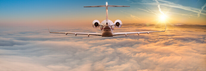 Fototapeta premium Small privat airplane flying above dramatic clouds.