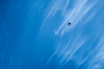 Fototapeta na wymiar the plane is flying in the sky, beautiful clouds.