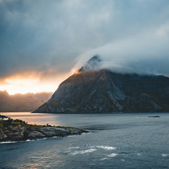 Dramatic sunset over the mountains and the sea of Lofoten islands in Norway