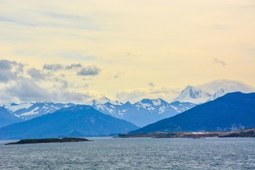 Panoramic view from cruise ship, harbor and snow mountains background Ushuaia City