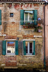 Obraz na płótnie Canvas Old colorful facade of a venetian building