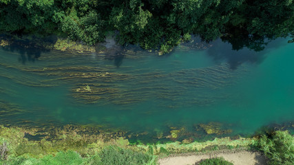 Ljubljanica is a river in central Slovenia. The Ljubljanica rises south of the town of Vrhnika and outflows in the Sava River about 10 kilometres downstream from Ljubljana. 