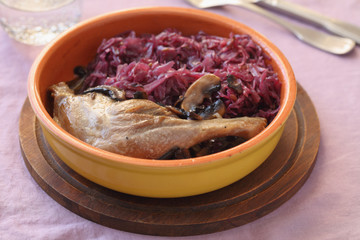 Roasted duck leg with mushrooms and red cabbage
