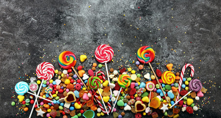 candies with jelly and sugar. colorful array of different childs sweets and treats.