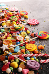 candies with jelly and sugar. colorful array of different childs sweets and treats.