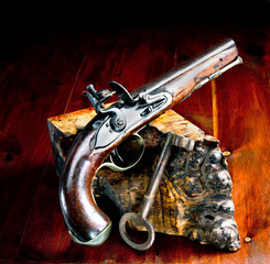 Flintlock Pistol and Jailers Key.