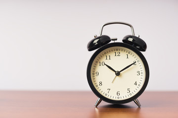 Black alarm clock, concept of time