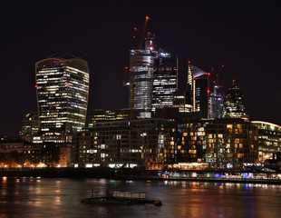 Fototapeta na wymiar Downtown City of London along the North Bank of the Thames River at night.