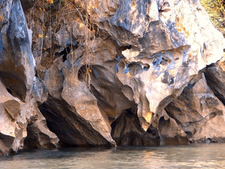 Rocky bank of the river. Stone texture. Beautiful rocks created by nature.