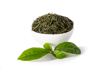 Green sencha tea in white cup with tealeaves © orinocoArt