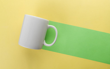 Mug green trail on yellow background - Negative space background concept