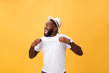Handsome young Afro-American man employee feeling excited, gesturing actively, keeping fists clenched, exclaiming joyfully with mouth wide opened, happy with good luck or promotion at work
