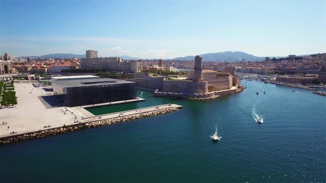 
4K Aerial view of Marseille pier - Vieux Port, Saint Jean castle, and mucem in south of France
