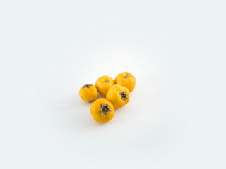 Yellow hawthorn berry with leaf isolated on white background close up path