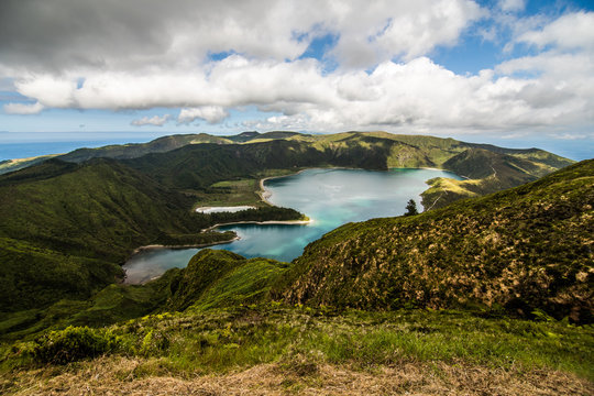 Lagoa do Fogo, a volcanic lake in Sao Miguel, Azores Island under the dramatic clouds