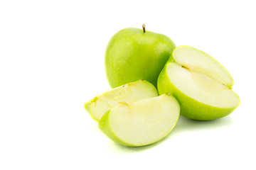 Ripe green apple with slices isolated on white background