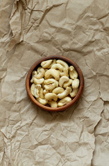 Cashews in a wooden bowl.