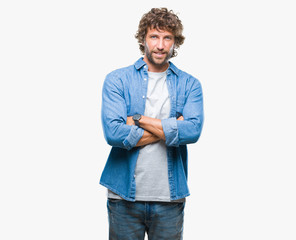 Handsome hispanic model man over isolated background happy face smiling with crossed arms looking at the camera. Positive person.