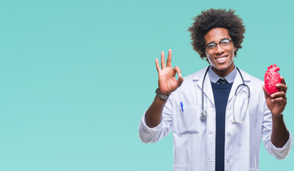 Afro american cardiologist doctor man over isolated background doing ok sign with fingers, excellent symbol - obrazy, fototapety, plakaty