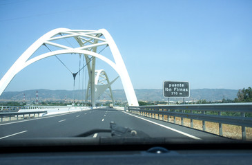 Obraz premium Driving by Ibn Abbas Firnas Bridge close to Cordoba City. View from the inside of the car