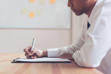 Businessman writing form submit resume employer to review job application. Concept presents ability...