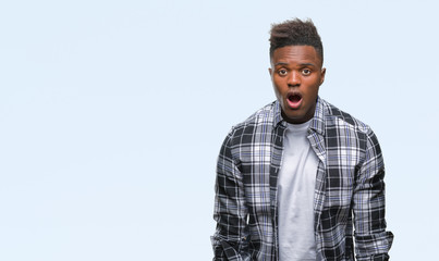 Young african american man over isolated background afraid and shocked with surprise expression, fear and excited face.