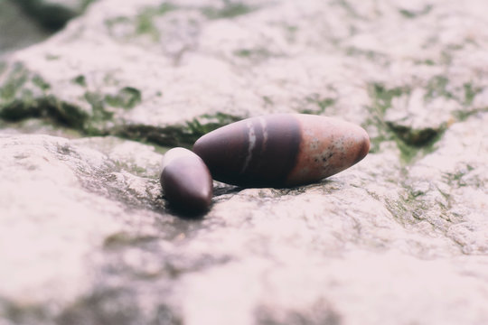 Two Shiva Lingam On A Rock Outside