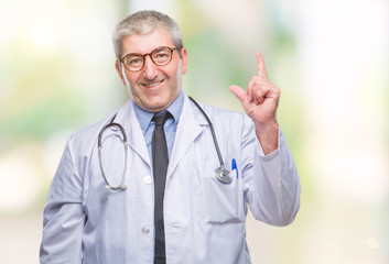 Handsome senior doctor man over isolated background pointing finger up with successful idea. Exited and happy. Number one.