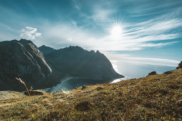 Fototapeta na wymiar View to Kvalvika beach from mount Ryten in Lofoten Islands Norway on a blue ans sunny day with some clouds.
