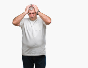 Handsome senior man over isolated background suffering from headache desperate and stressed because pain and migraine. Hands on head.