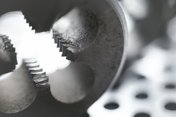 Thread cutting die at factory workshop