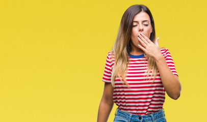 Young beautiful woman casual look over isolated background bored yawning tired covering mouth with hand. Restless and sleepiness.