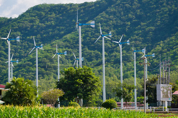Windmills for electric power production in Royal Initiative Project Chang Hua Mun project demonstrate holistic agriculture for sufficient economy at Hua Hin, Phetchaburi, Thailand
