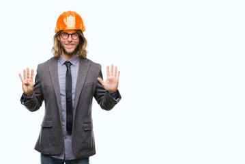 Young handsome architec man with long hair wearing safety helmet over isolated background showing and pointing up with fingers number nine while smiling confident and happy.